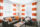 Furnished apartment living room decorated with orange decor