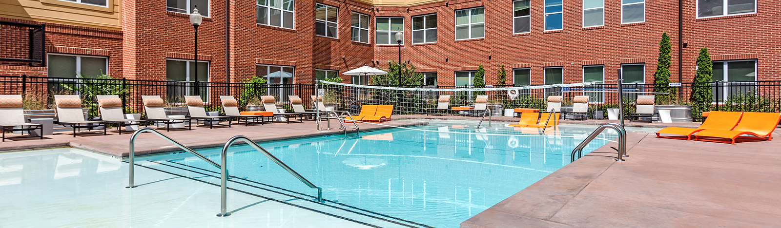 Resort style pool surrounded by lounge chairs