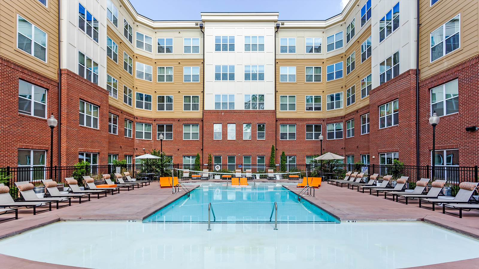 Resort style pool surrounded by lounge chairs